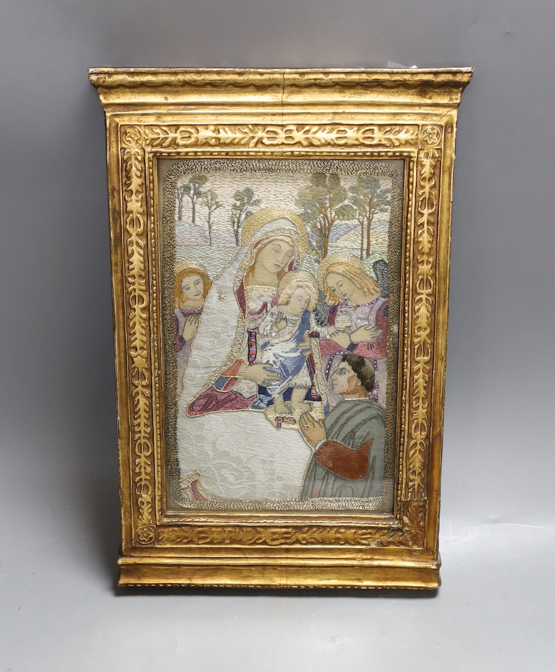 A silk thread embroidery of the 'Madonna of Peace', 36x24cm including gilt frame